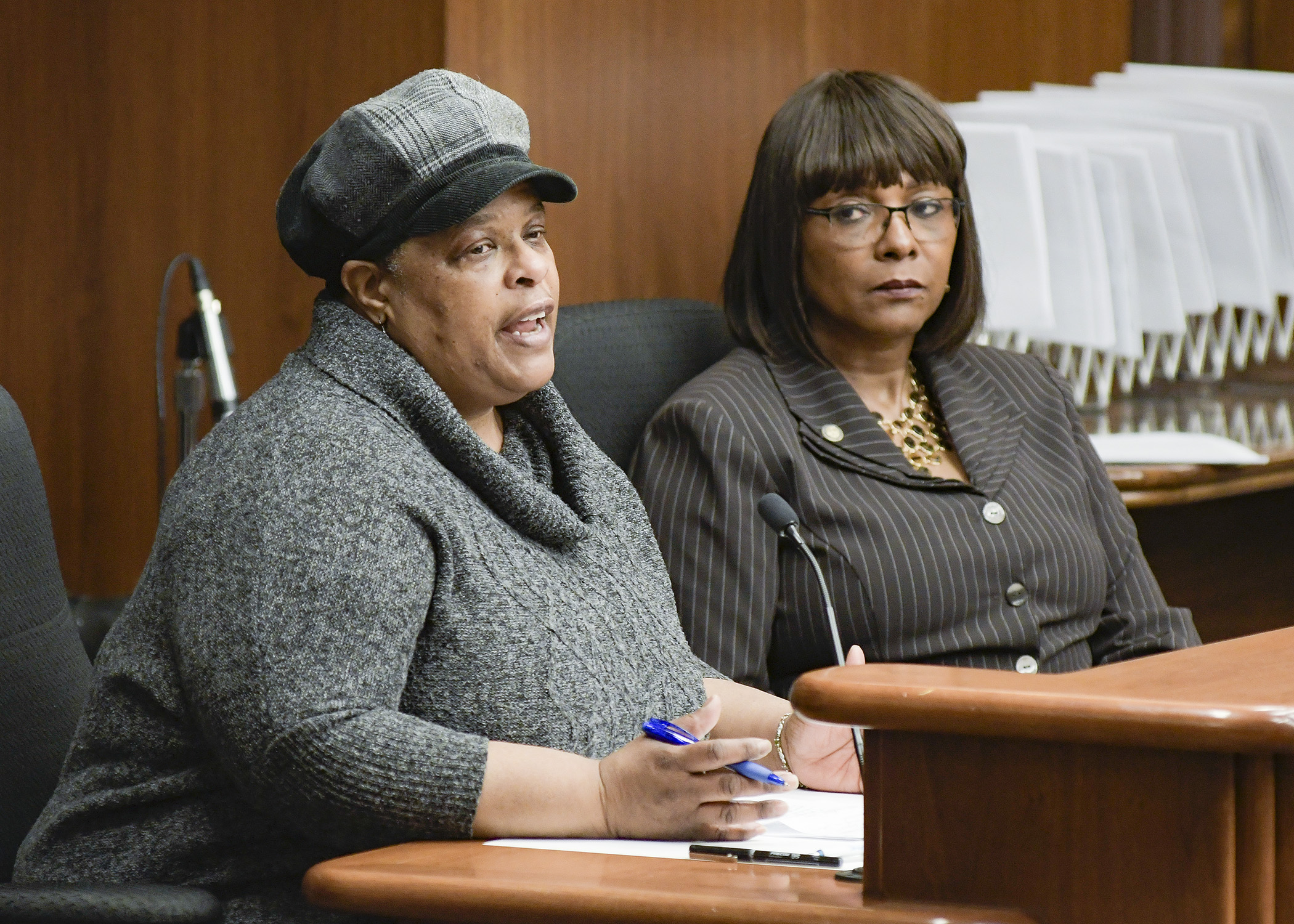 Parent Jacquie Thomas testifies before the House Subcommittee on Childcare Access and Affordability March 14 in support of a bill sponsored by Rep. Rena Moran, right, that would establish a task force on childhood trauma. Photo by Andrew VonBank